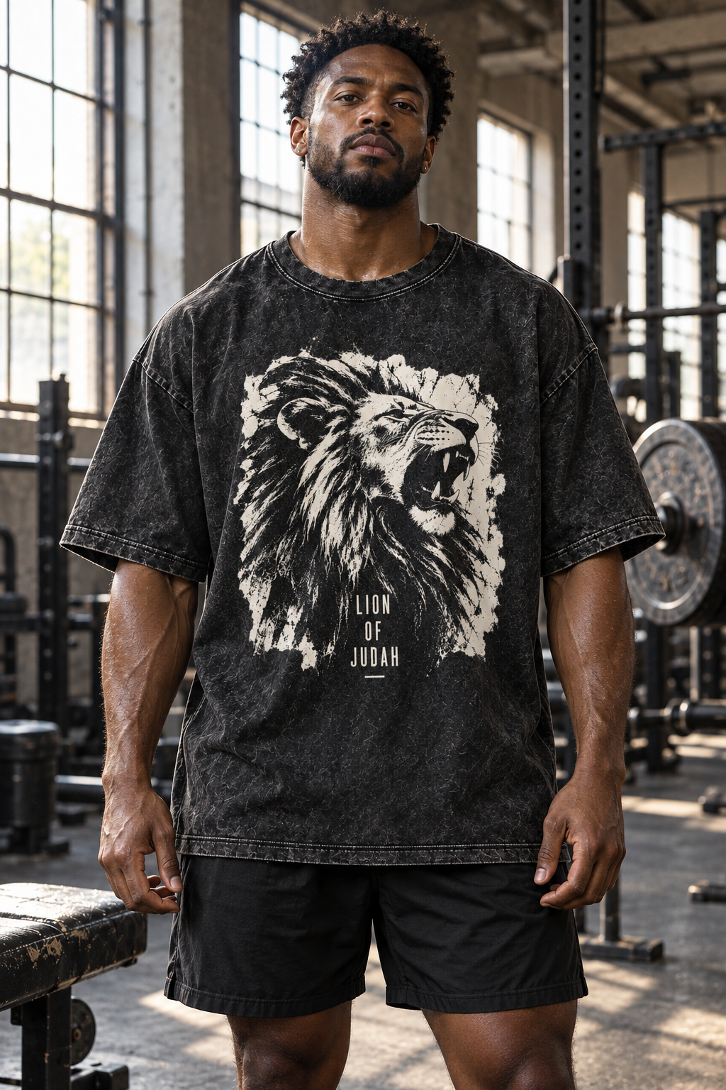 Man in a warehouse gym wearing the Lion of Judah tee