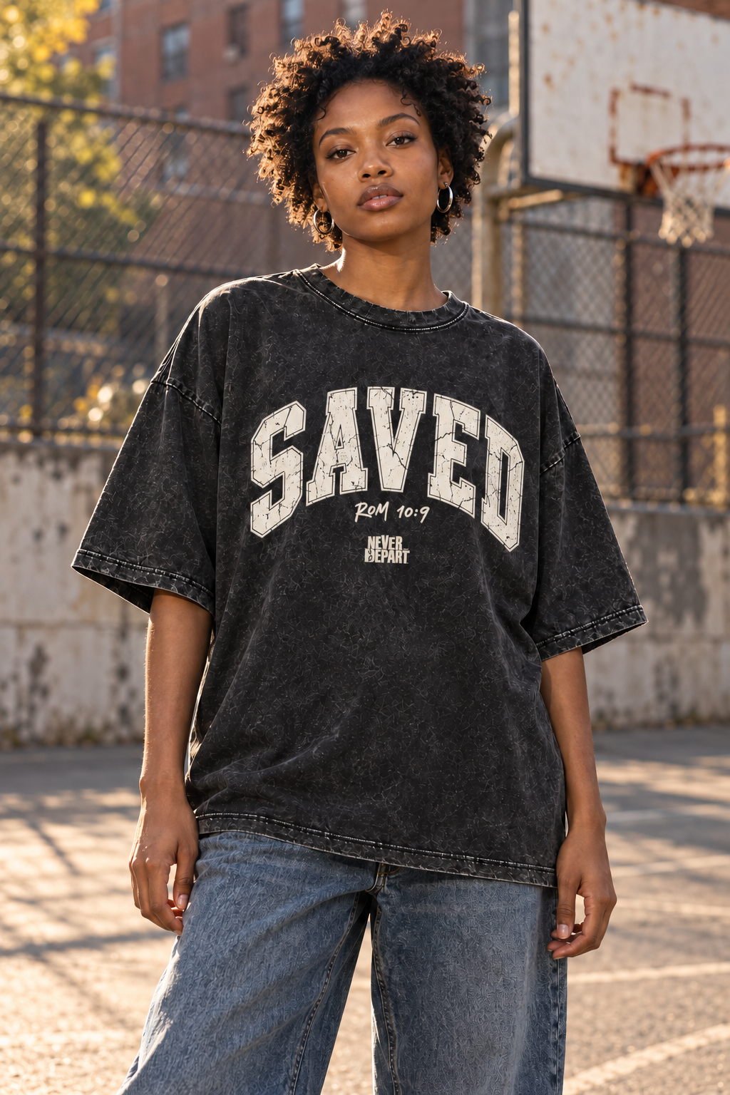 Woman on a basketball court wearing the Saved tee
